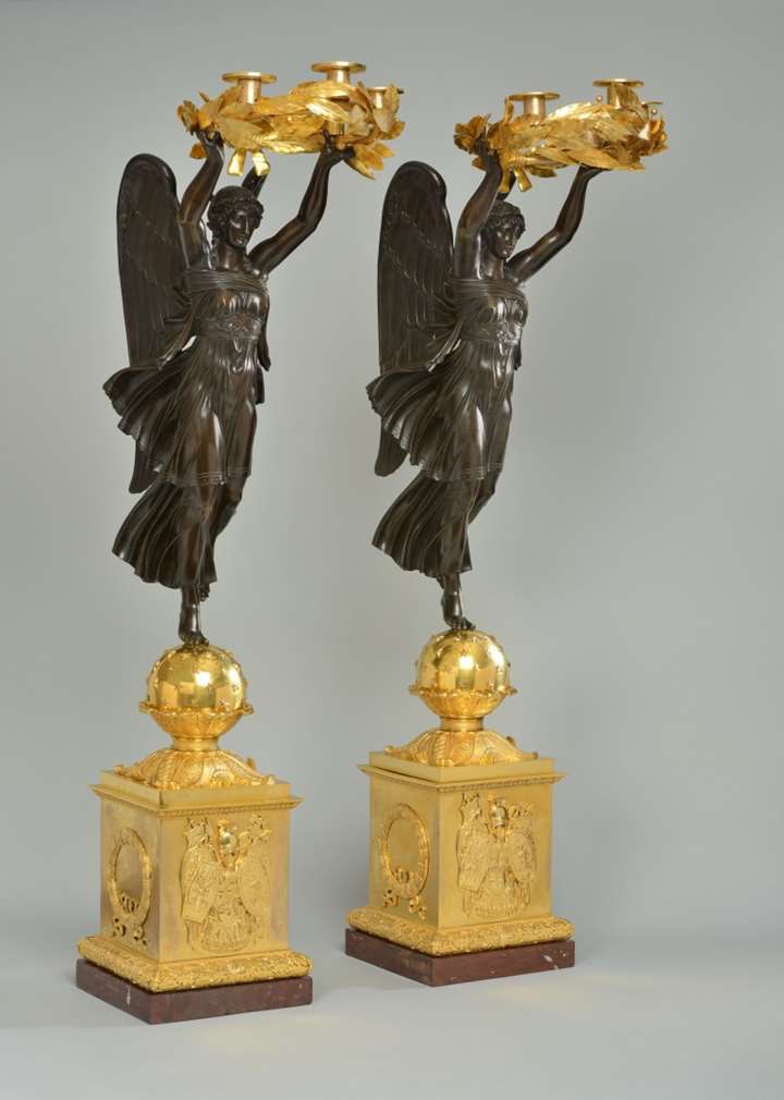 A very important pair of empire ormolu and patinated bronze four-light candelabra